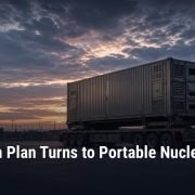Fostoria News illustration: a shipping-container-sized portable nuclear reactor on a flatbed truck at a military base, with darkened power lines in the background